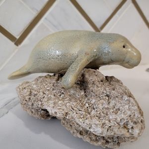 Ceramic manatee on a shell rock. This plus size mermaid is cute beach decor!